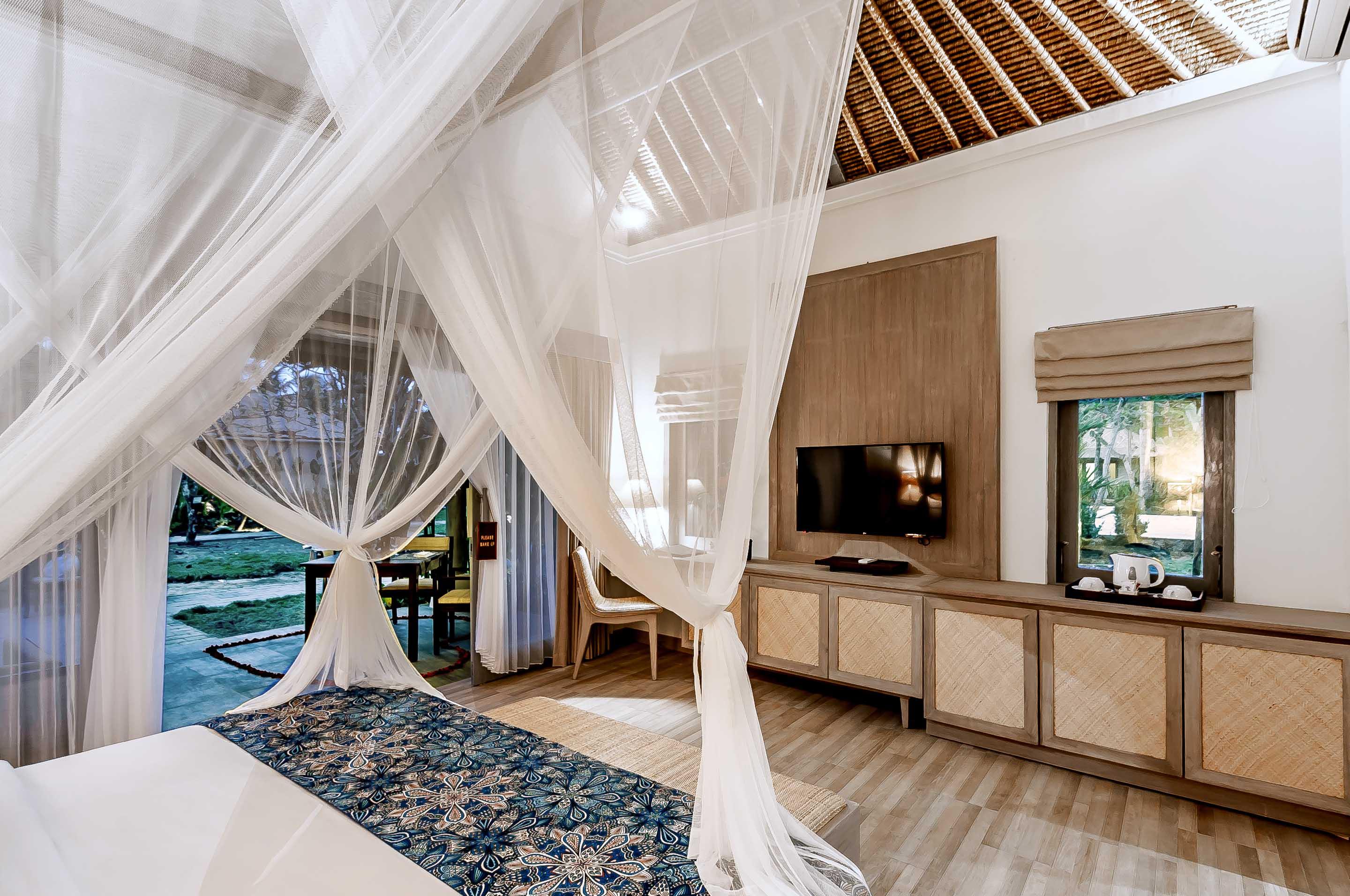 ニルワナ ビーチ アンド リゾート チャンディダサ エクステリア 写真 A bedroom at the resort