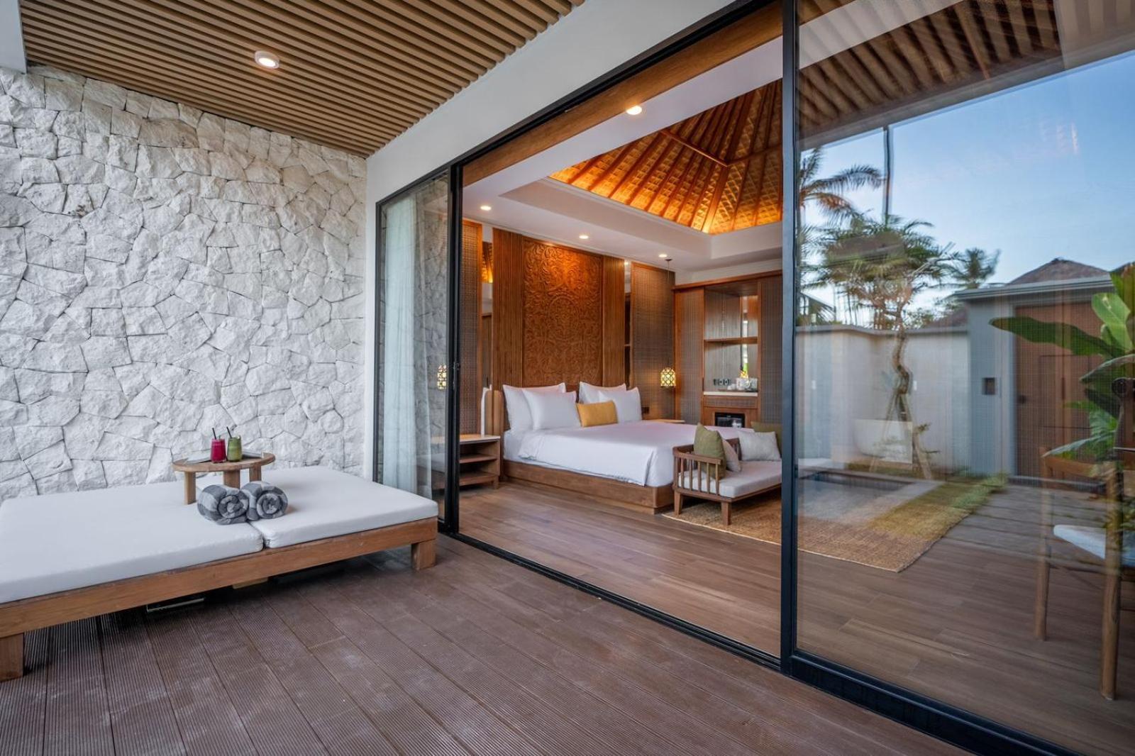 ニルワナ ビーチ アンド リゾート チャンディダサ エクステリア 写真 A bedroom at the resort