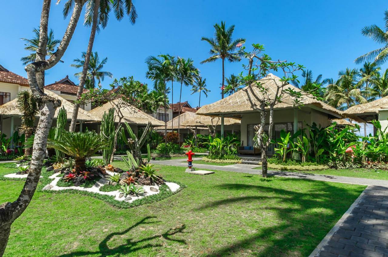 ニルワナ ビーチ アンド リゾート チャンディダサ エクステリア 写真 The resort's grounds